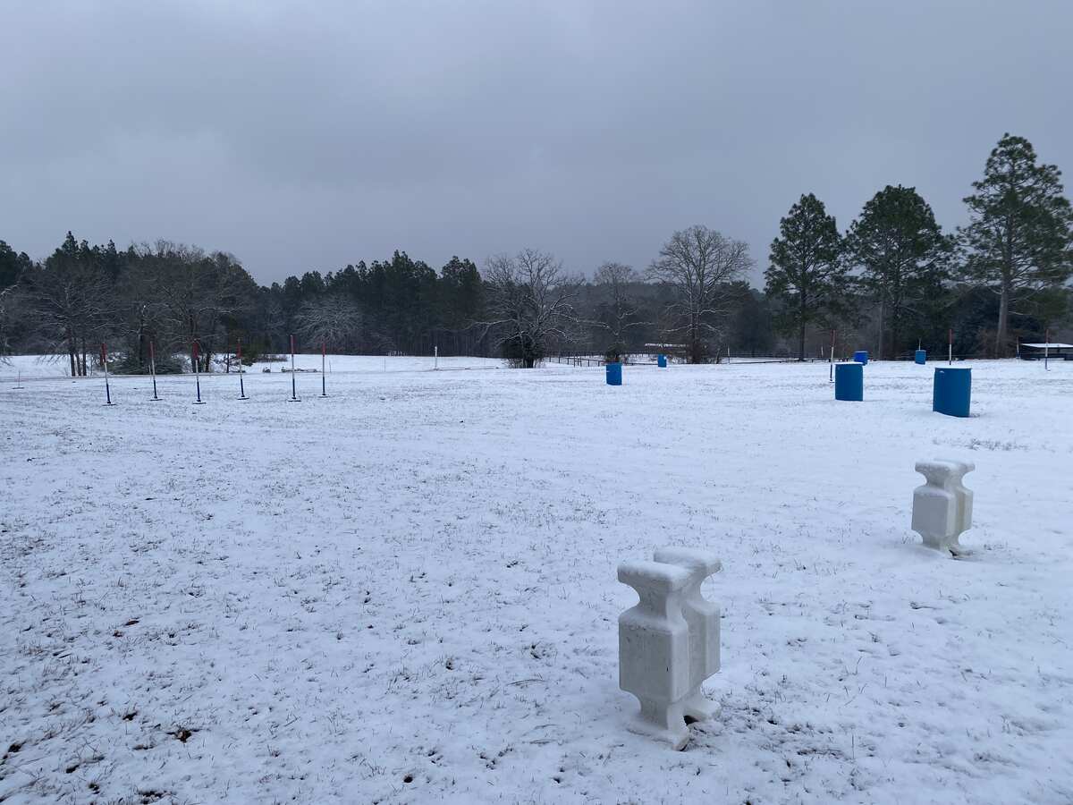 Field covered in snow, with some obstacles showing.